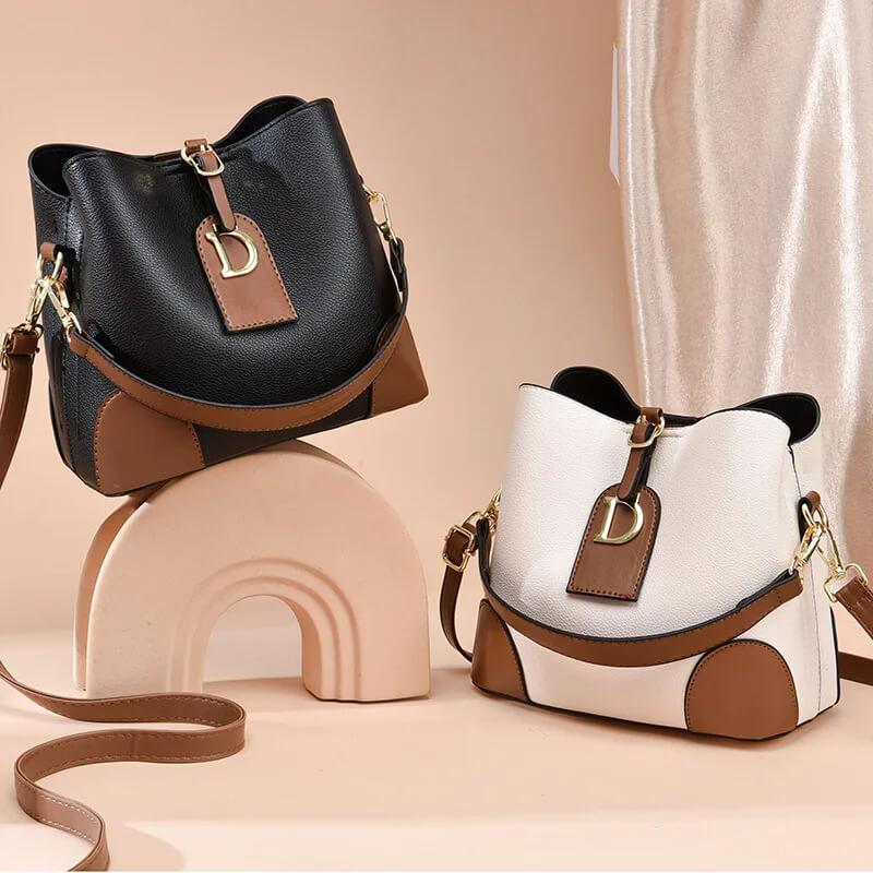 Modeva - Designerinspirerad Vintage Läderhandväska med Hink och Axelrem