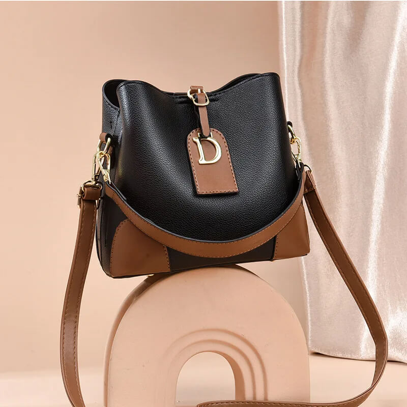 Modeva - Designerinspirerad Vintage Läderhandväska med Hink och Axelrem