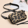 Travel bag-inspired crossbody bag